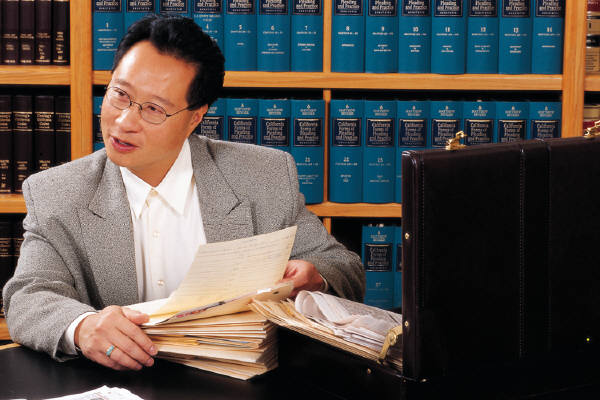 Patent Lawyers at work with Patent research legal team resolving patent law issues.